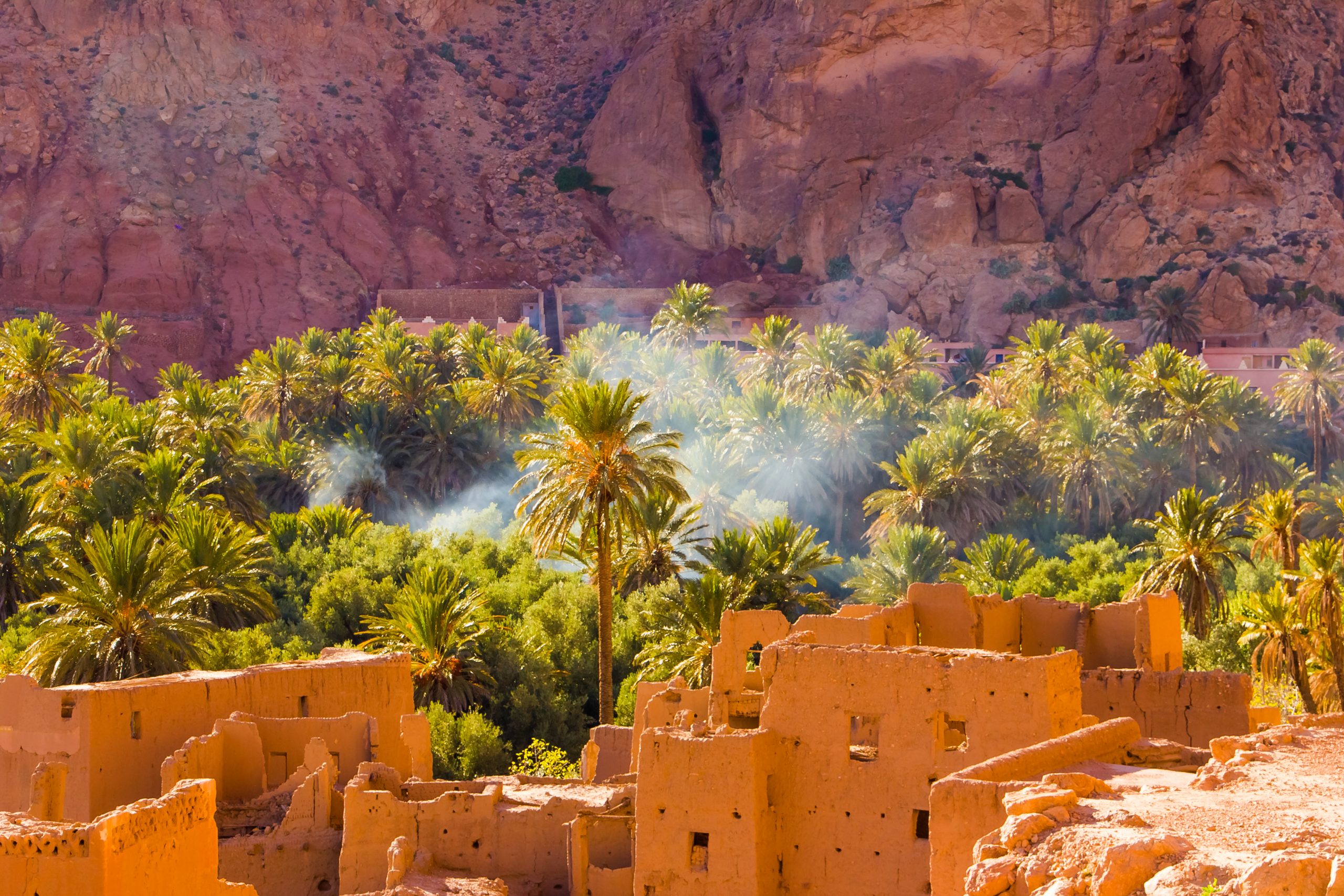 The ancient moroccan town near Tinghir with old kasbahs and high Atlas mountains in background, Tinghir, Morocco in Africa