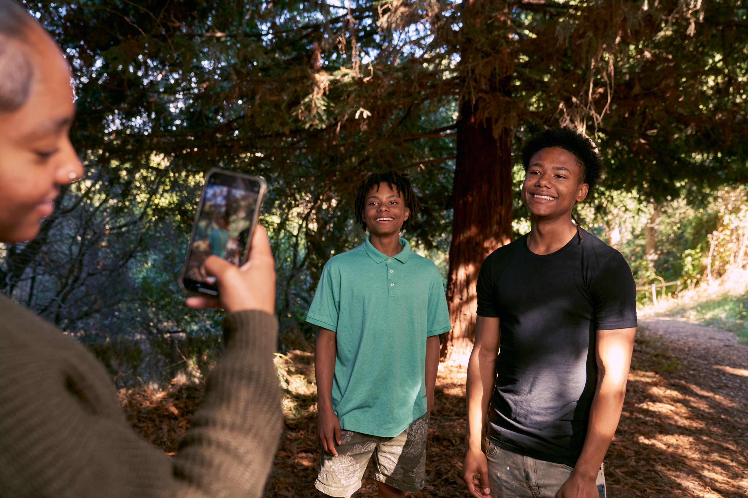 Young Black Teenage Siblings Taking a Selfie in Nature Together Playing