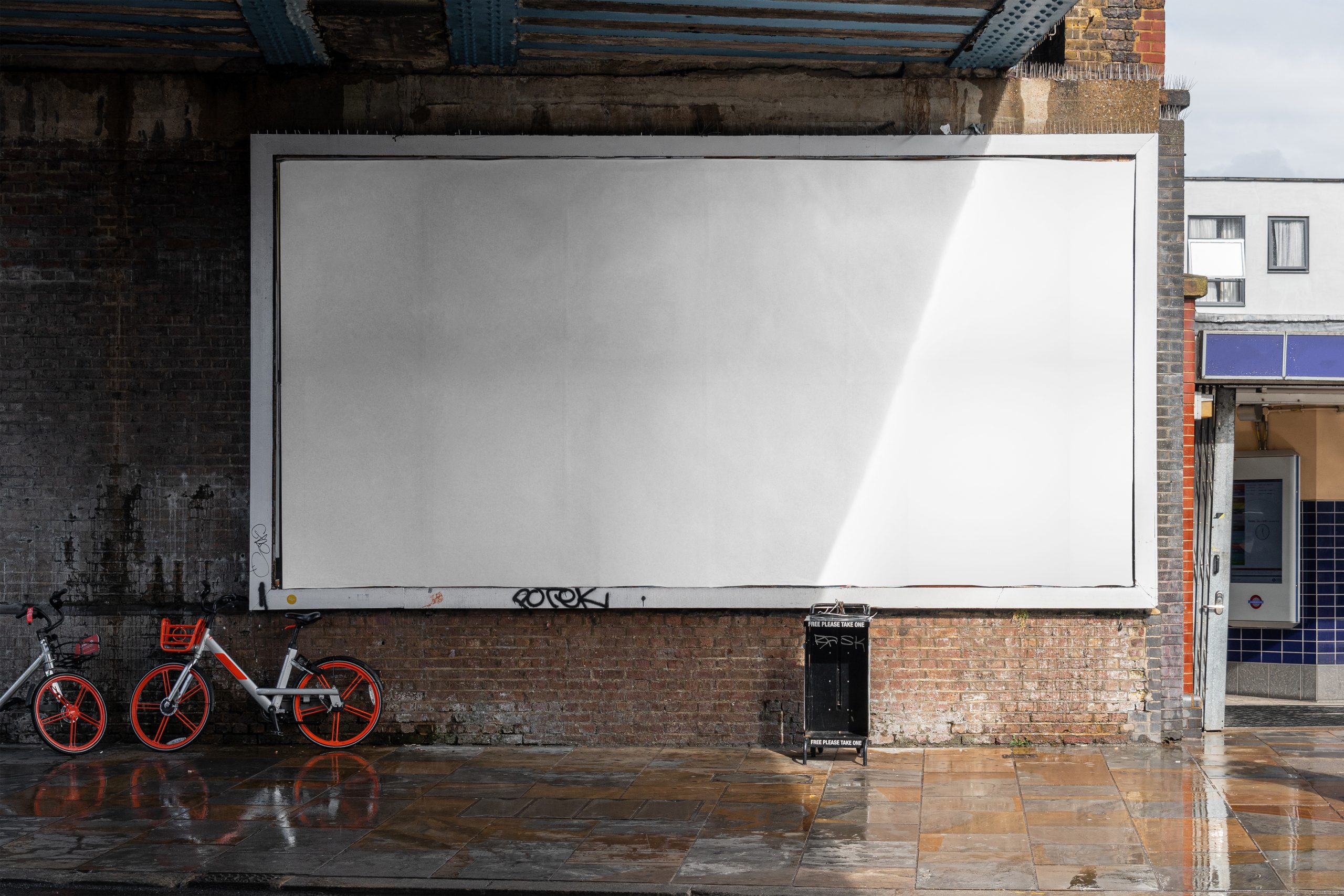 Blank billboard sign mockup in the urban environment, on the fac